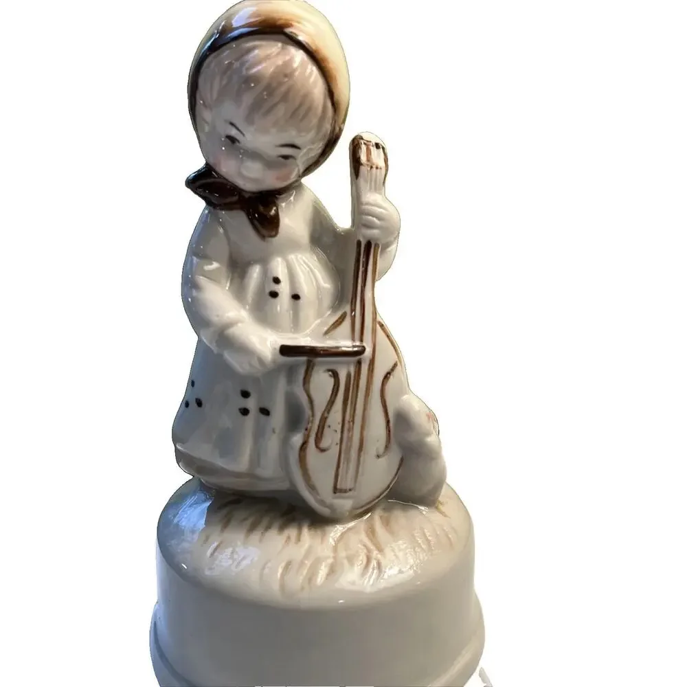 Vintage bisque girl playing cello W/ Bunny music box 1983 tune “feelings” W/BOX
